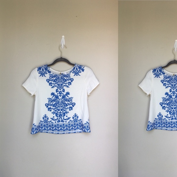 Xhilaration Tops - Xhilaration ~ off white top w/blue design& keyhole